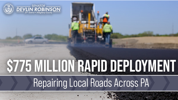 construction workers repairing a road with the phrase, “$775 million Rapid Deployment Repairing Local Roads Across PA” over it.&nbsp; &nbsp;